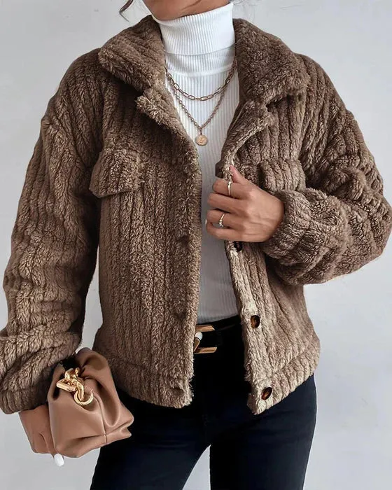 Simple, thick, long-sleeved coat with lapel and buttons.