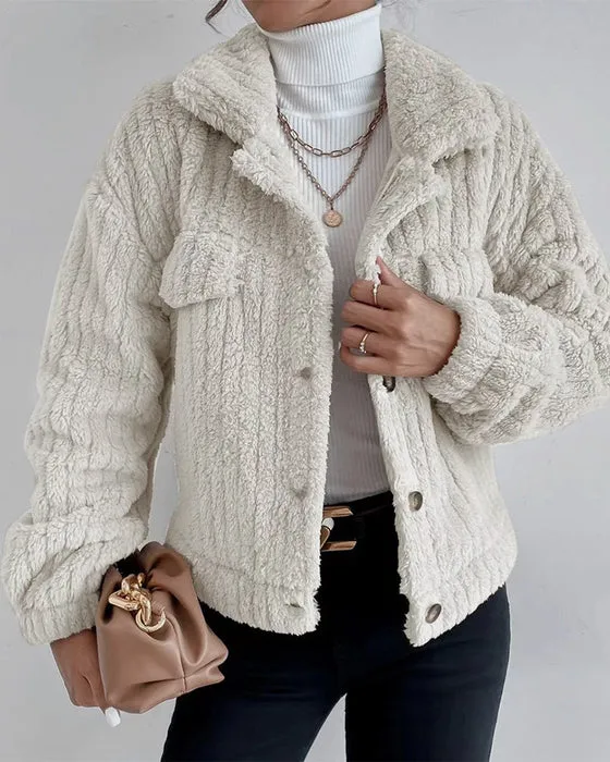 Simple, thick, long-sleeved coat with lapel and buttons.